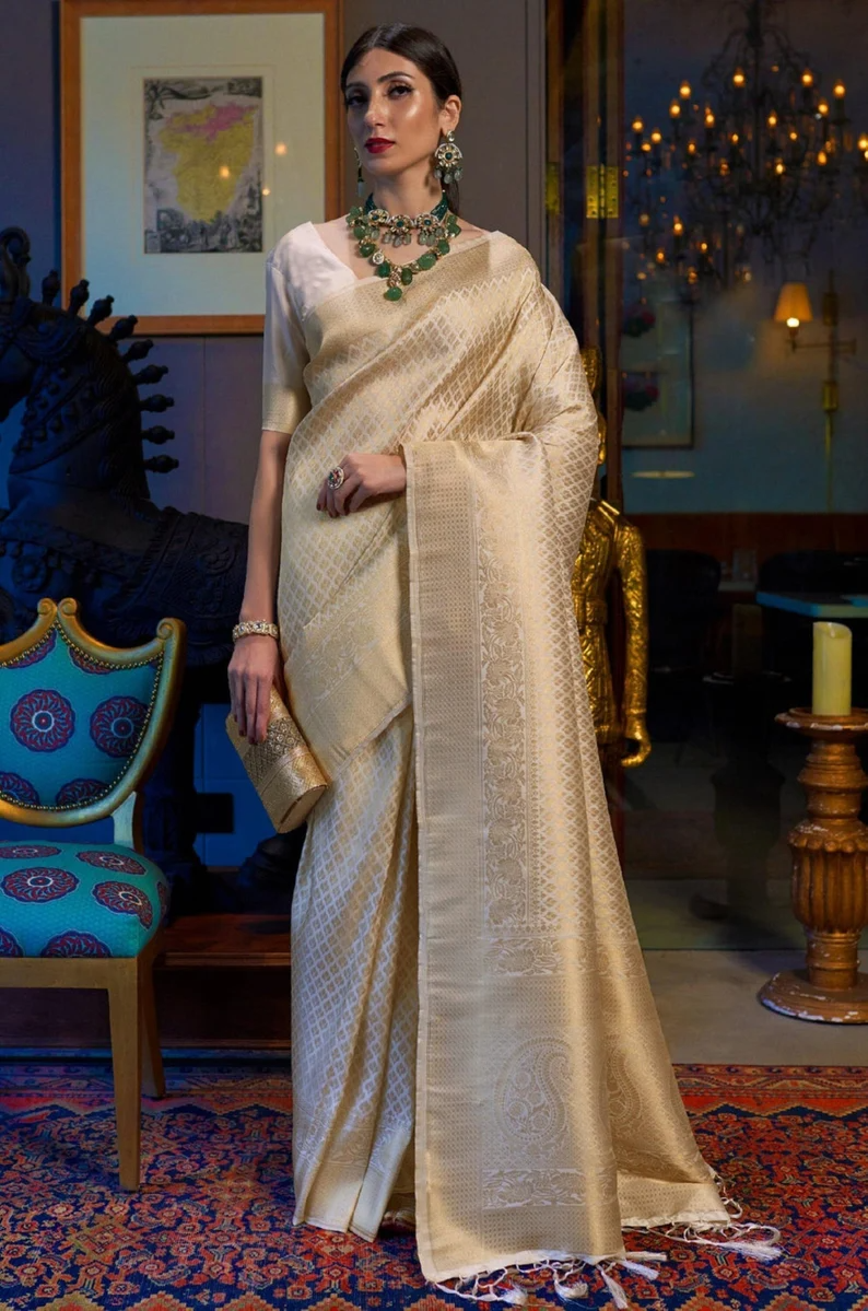 Elision Beige Kanjivaram Silk Saree With Dazzling Blouse Piece